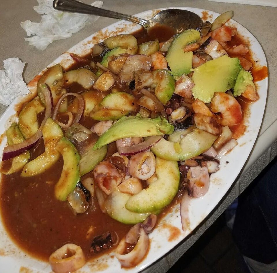 Seafood dishes on a casual restaurant table